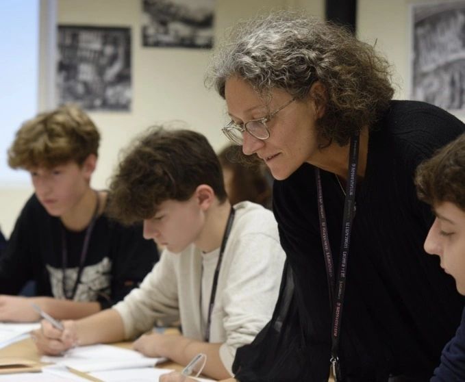 A Progress Tutoring teacher helping students with their work